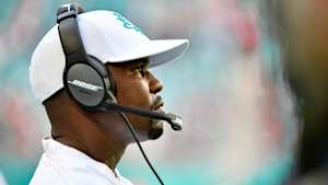 Dolphins coach Brian Flores looks on.